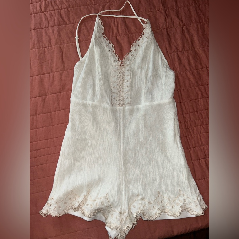 Fringe romper with zip in the back and adjustable straps